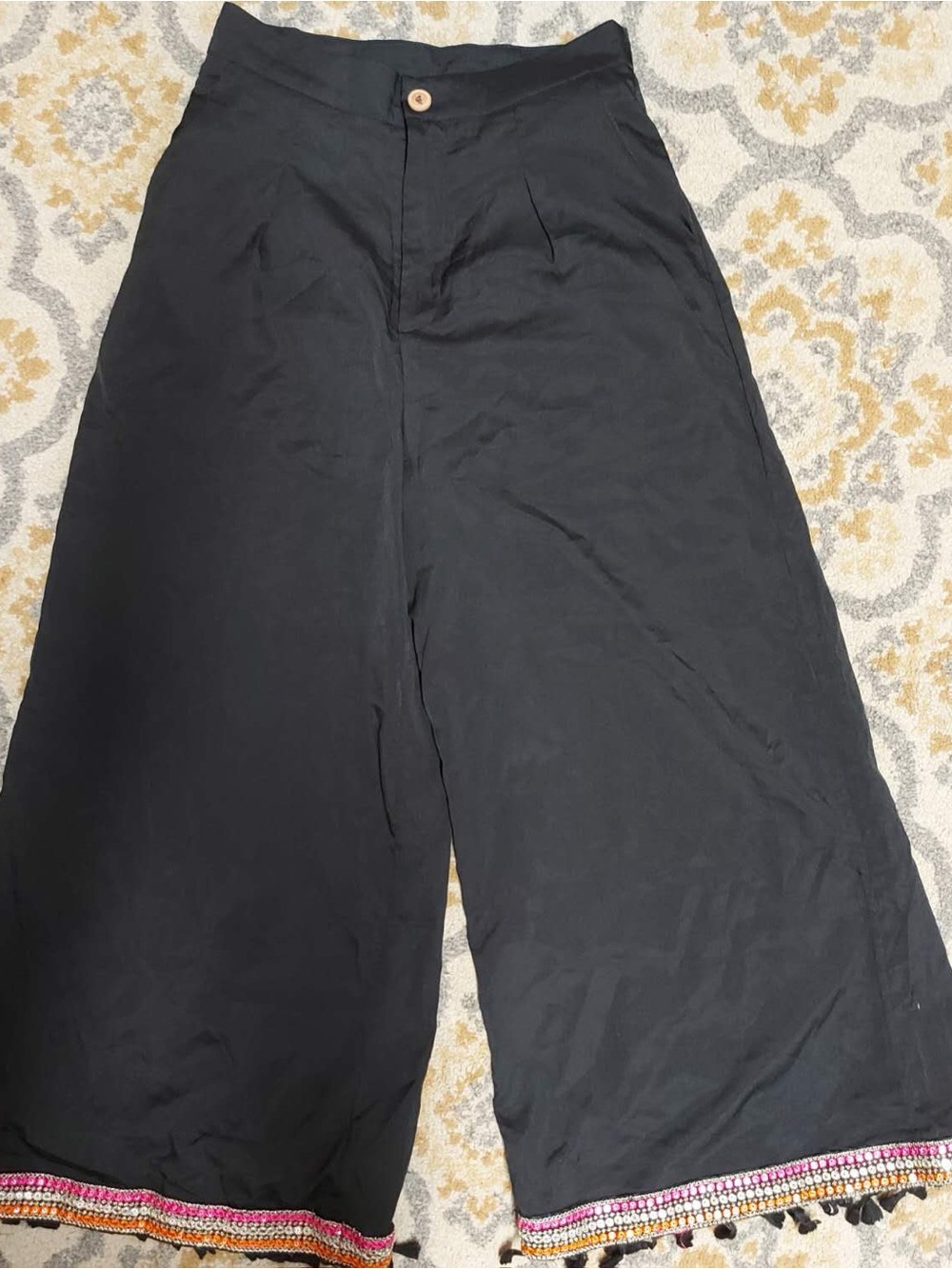Black wide leg pants with tassels